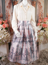 Pink pleated skirt with black pattern