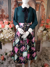 Black Pink pleated skirt with handbag print