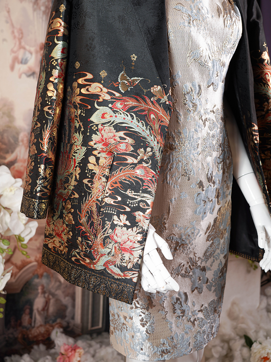 Black blazer with an ornate gold and multicolored floral print.