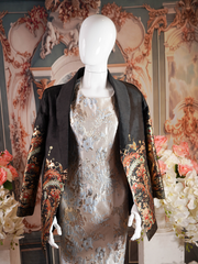Black blazer with an ornate gold and multicolored floral print.