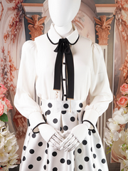 White Blouse With Black Necktie