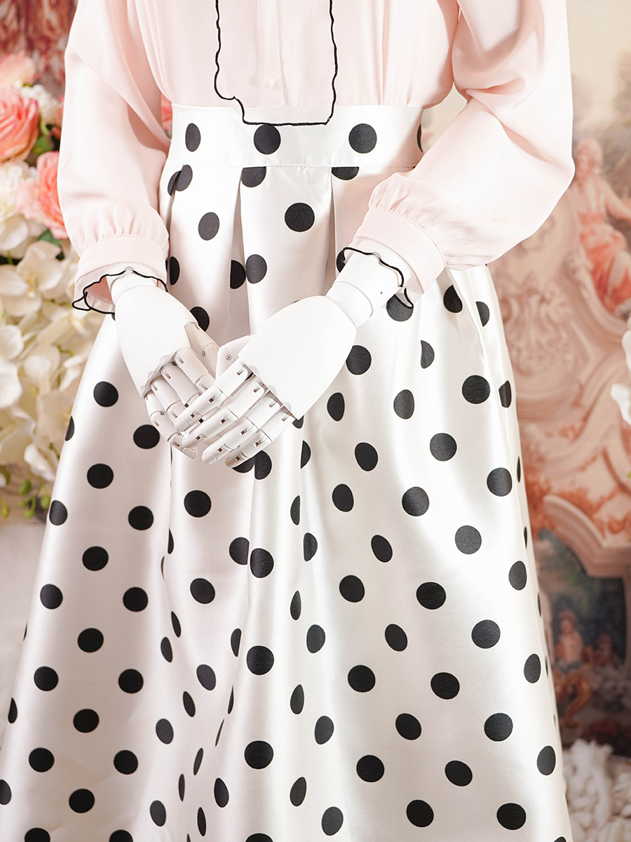 White pleated midi skirt with black polka dots
