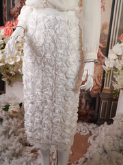 White midi skirt covered in 3D rose appliqués