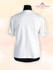 White t-shirt with a large white ruffle detail on one shoulder