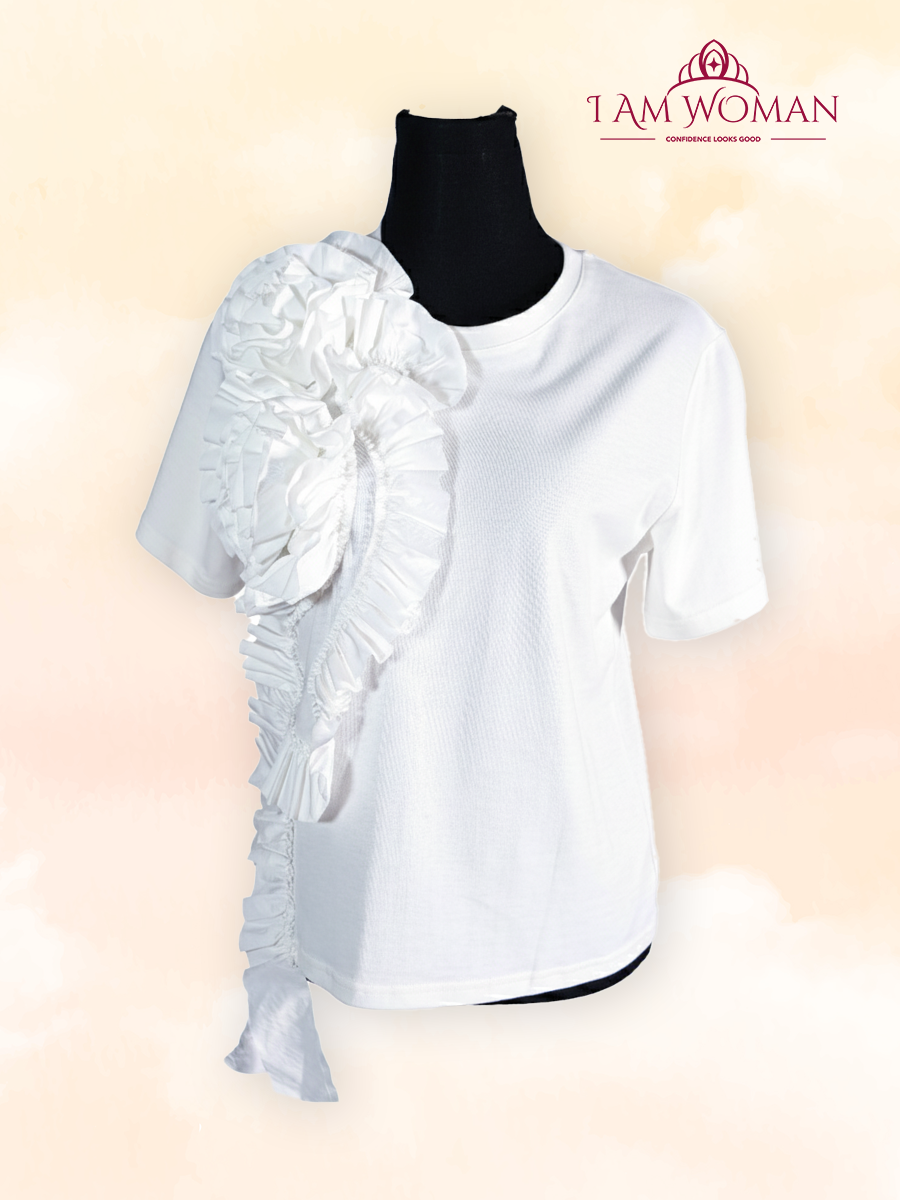 White t-shirt with a large white ruffle detail on one shoulder